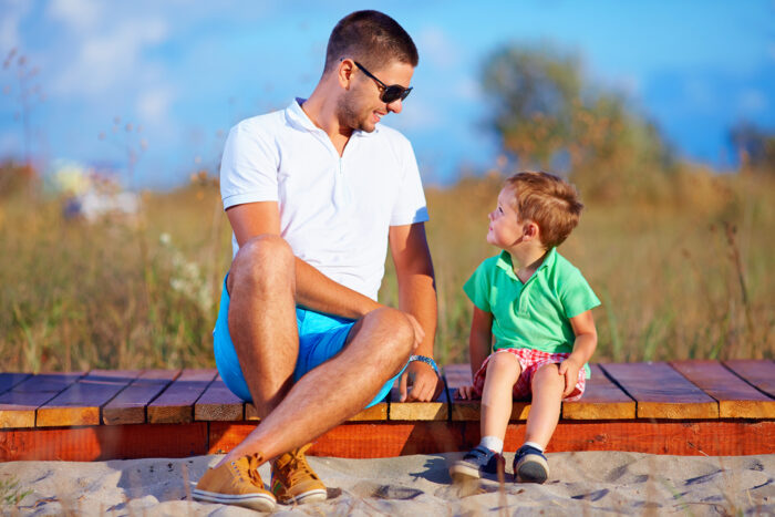 father and son talking, summer outdoor